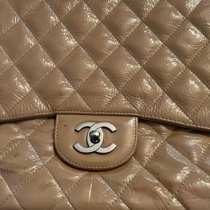 Beautiful patent leather Chanel purse. Kept very well. It is used. clean inside